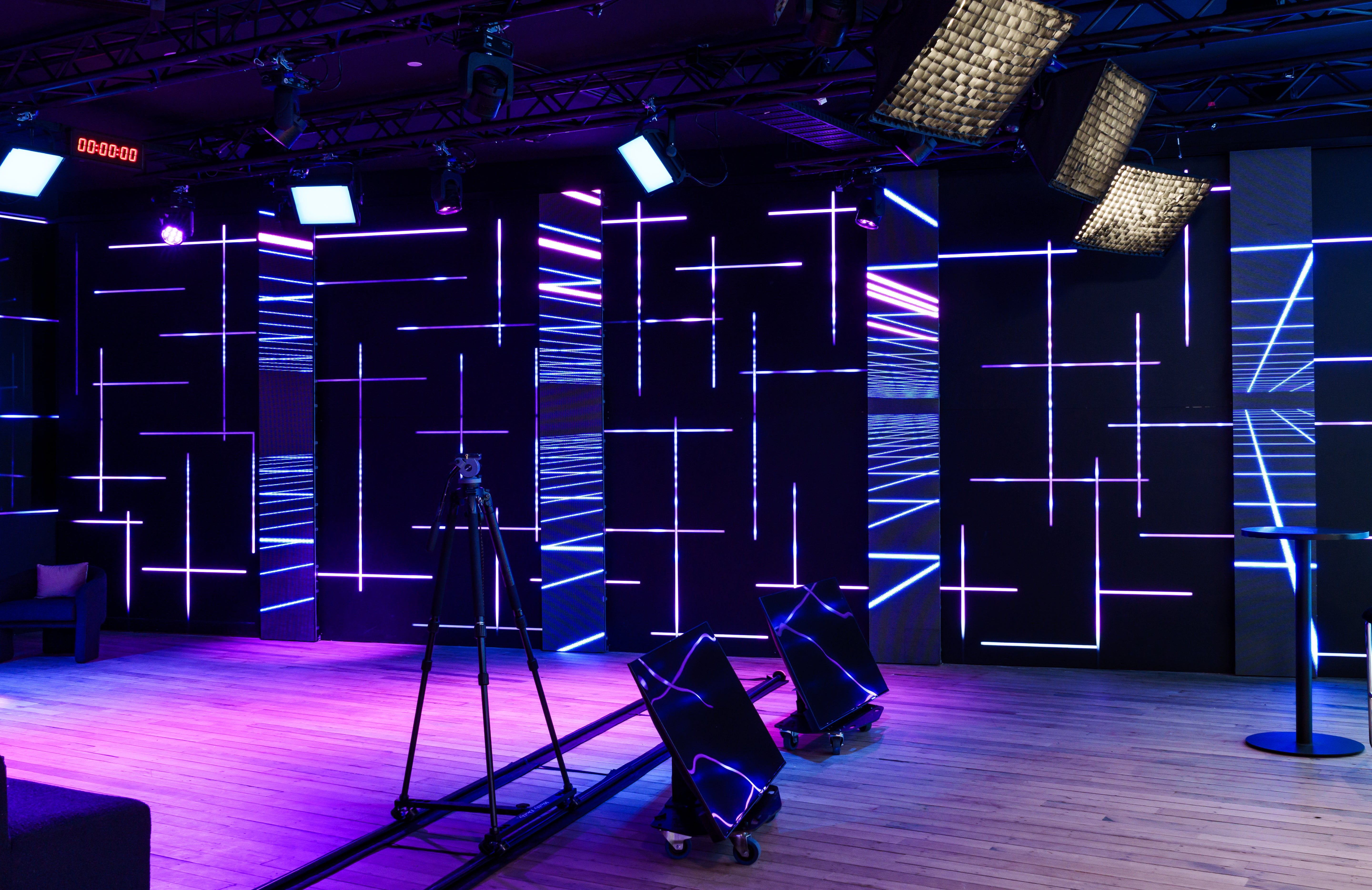 Modern interior with geometric light patterns on walls and floor.