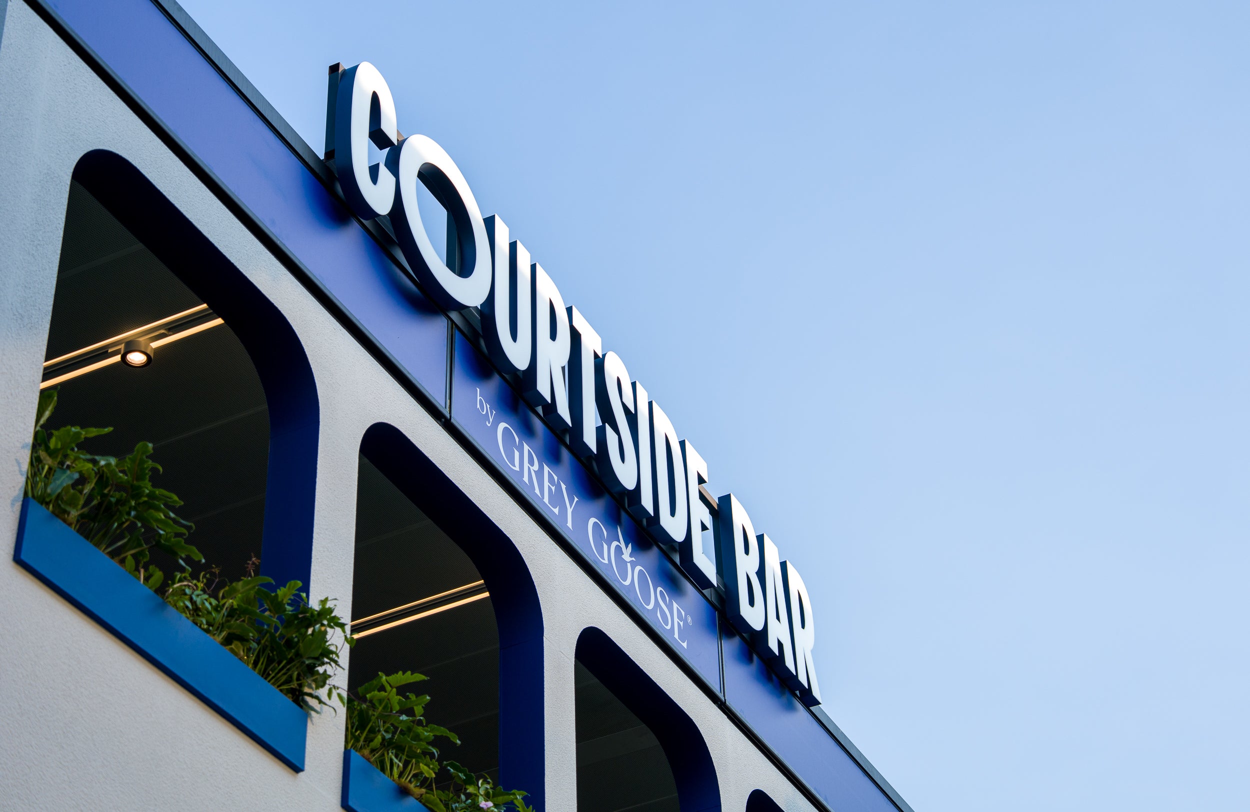 Courtside Bar by Grey Goose sign on a marquee exterior at AO