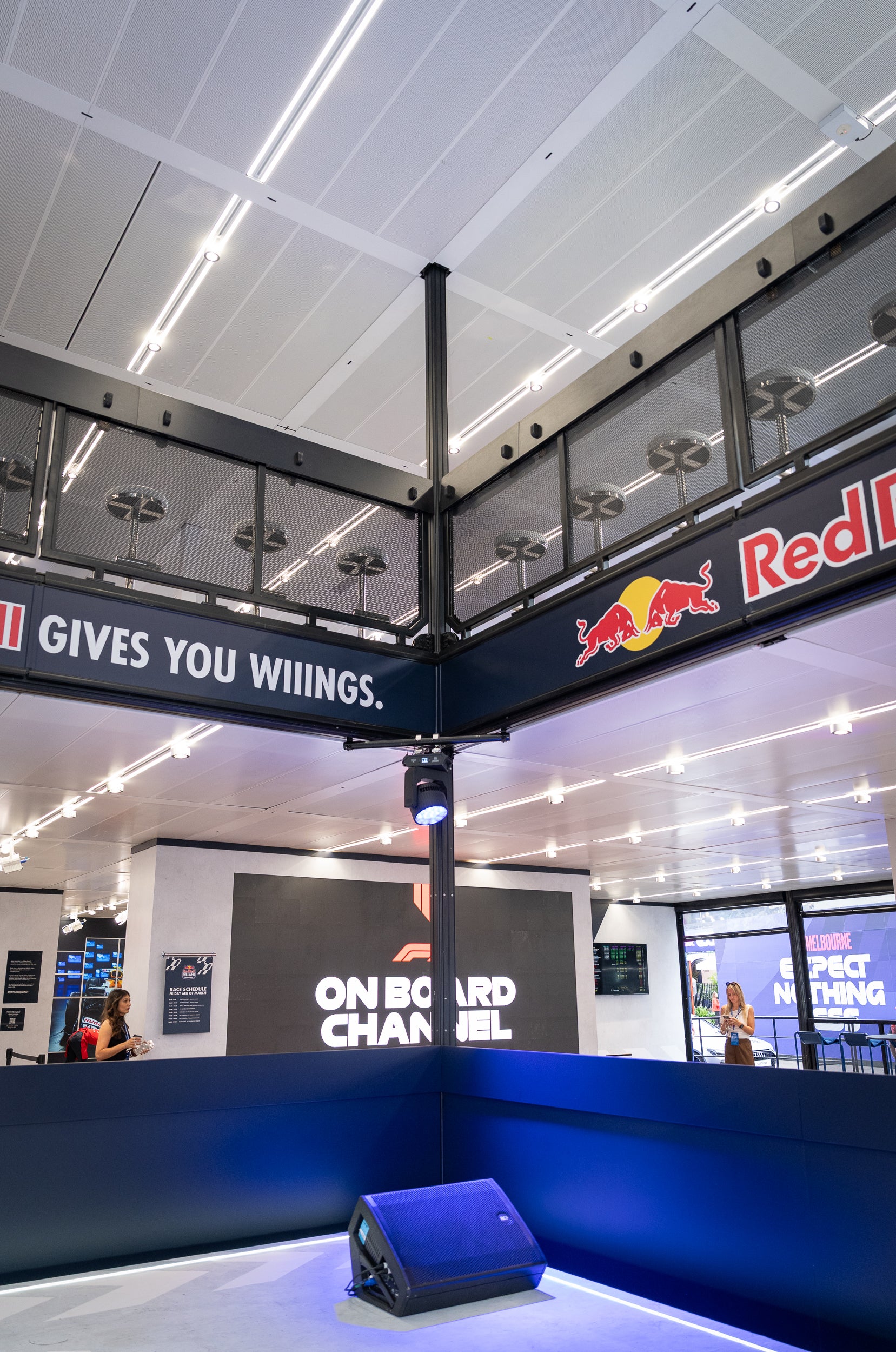 Marquee interior with Red Bull branding and promotional text.