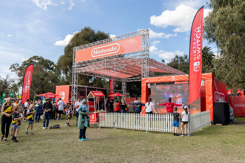 Outdoor activation with a Nintendo display and people around