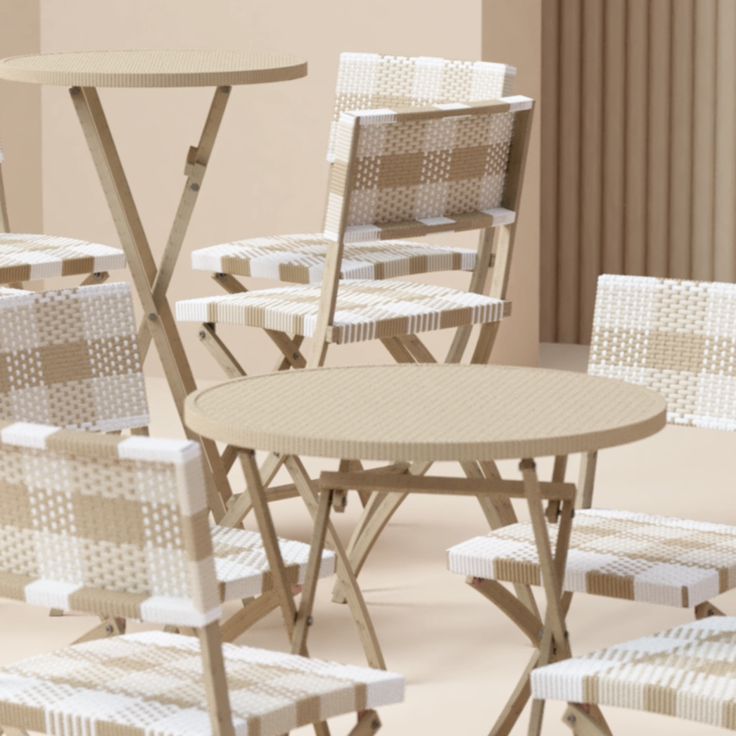 Beige outdoor table and chairs set on a neutral background