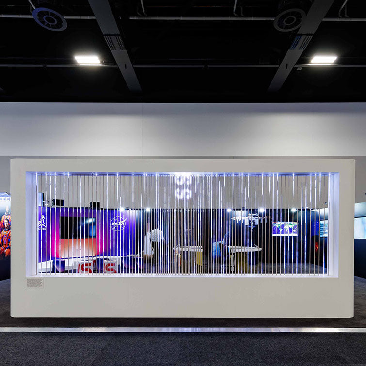 Exhibition display with colorful lighting and custom fittings in a modern indoor setting