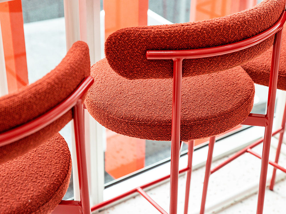 Margot chairs with a reflective surface in the background