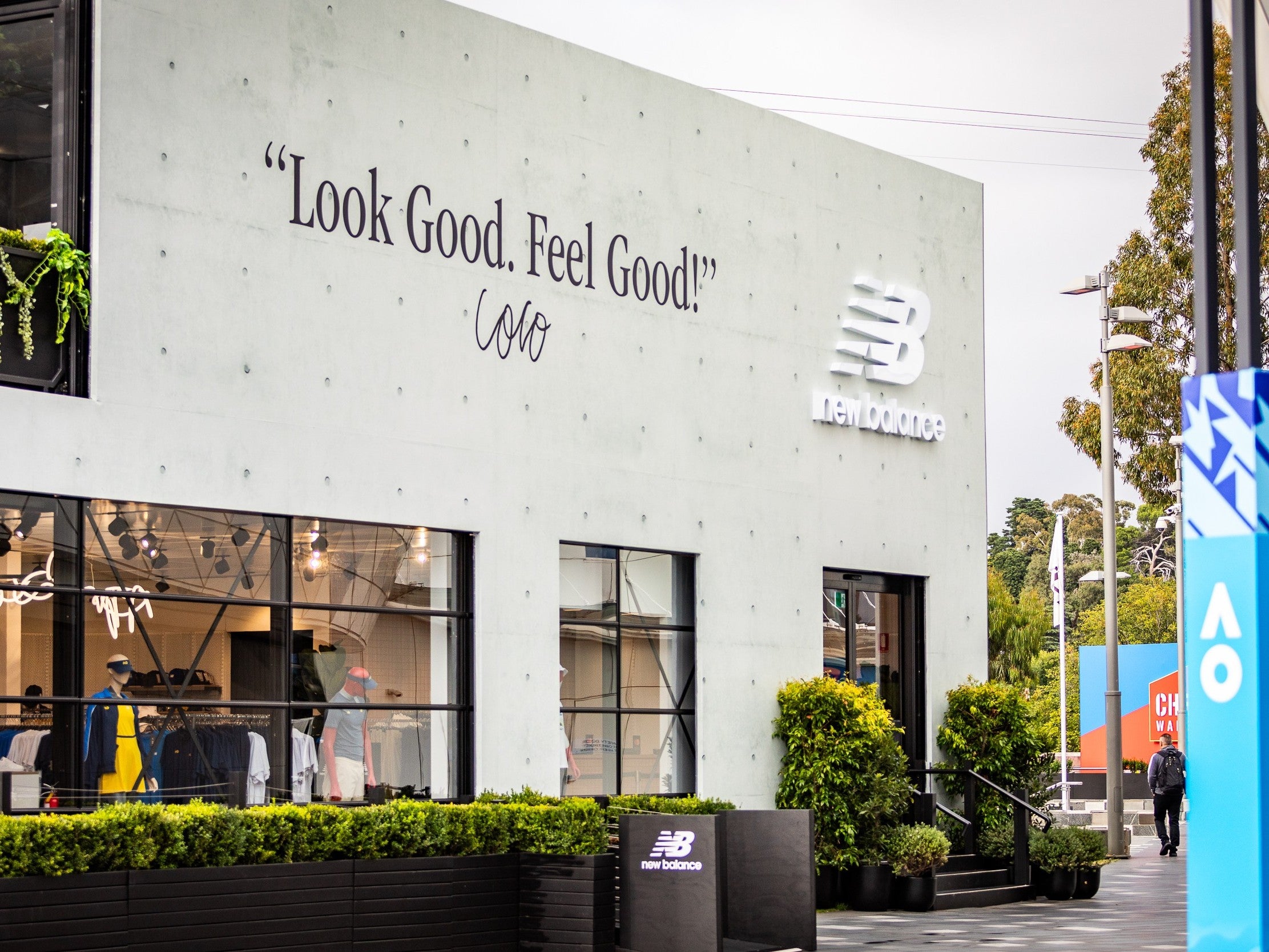 New Balance store exterior with branding and 'Look Good, Feel Good!' slogan.
