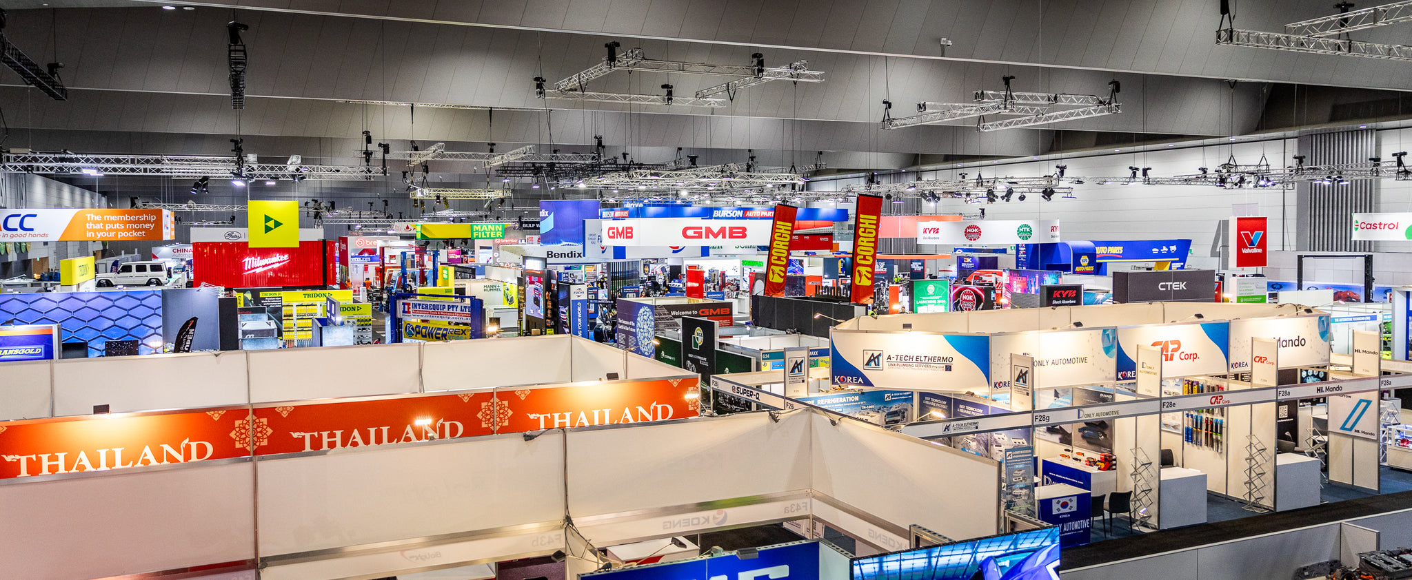 Exhibition hall with various booths and displays at a trade show.