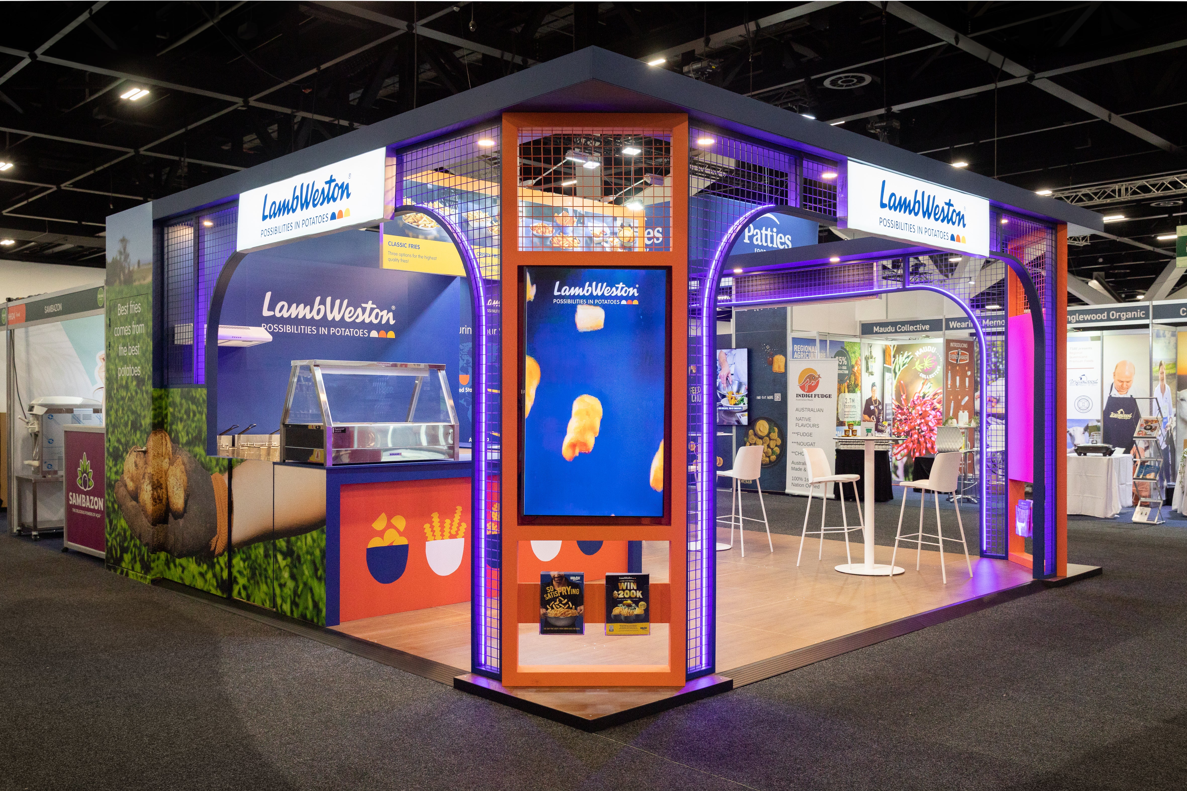Lamb Weston exhibition stand at a trade show with colorful design and branding.