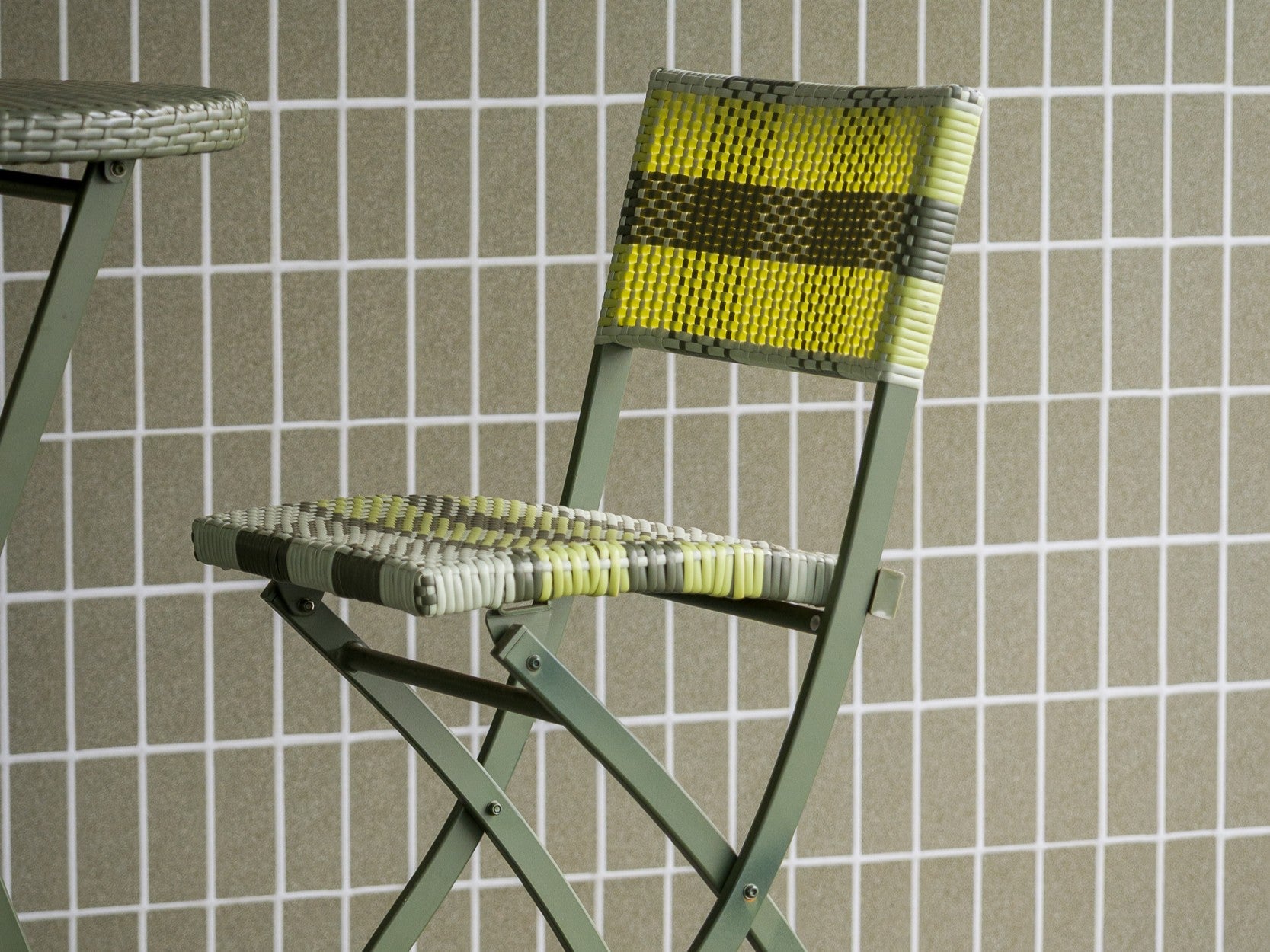 Green Cleo lattice-back chairs arranged in a casual setting onsite at Liv Golf in Adelaide