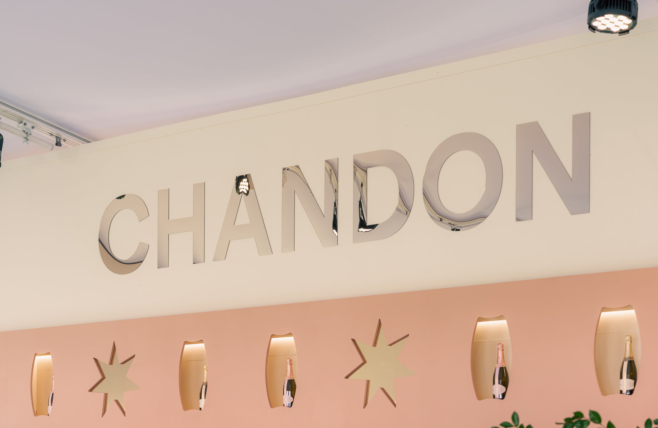 Chandon logo on a wall with decorative elements