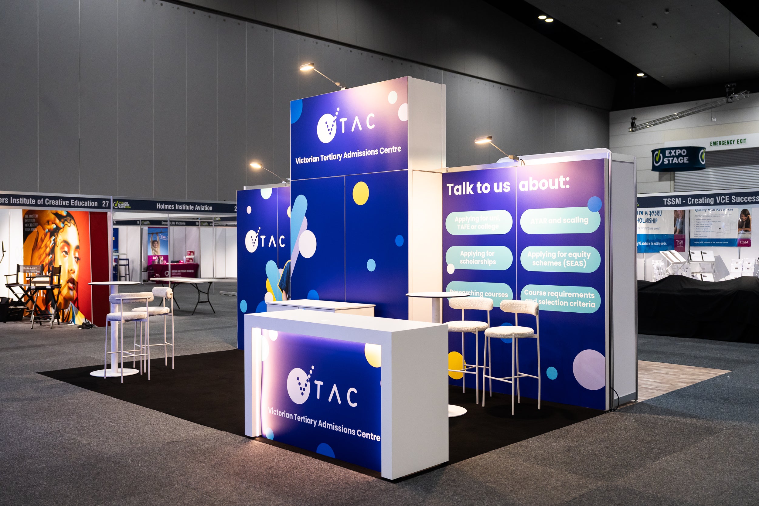 Exhibition stand with VTAC branding in a conference center setting