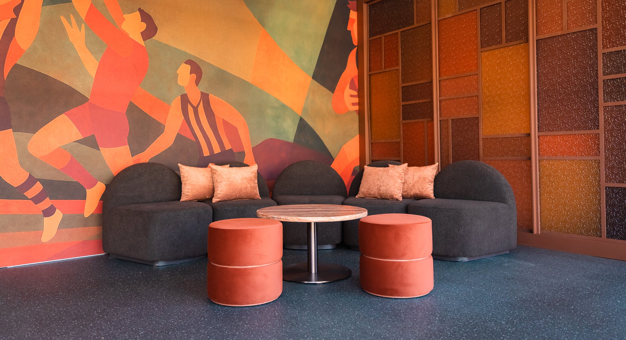 Interior of a Marquee with a Harper Sofa, Halo table, Arden Ottoman and custom printed signage for AFL.
