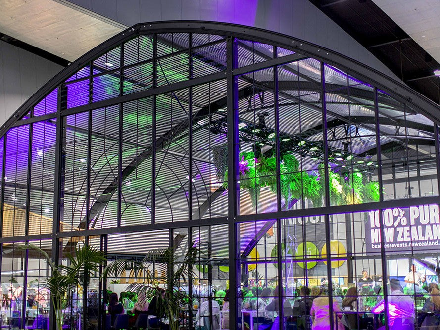 Atrium Marquee at he Melbourne Convention and Exhibition Centre - MCEC. Our structure has been used as a expo stand, and is lit up with green and purple lighting.