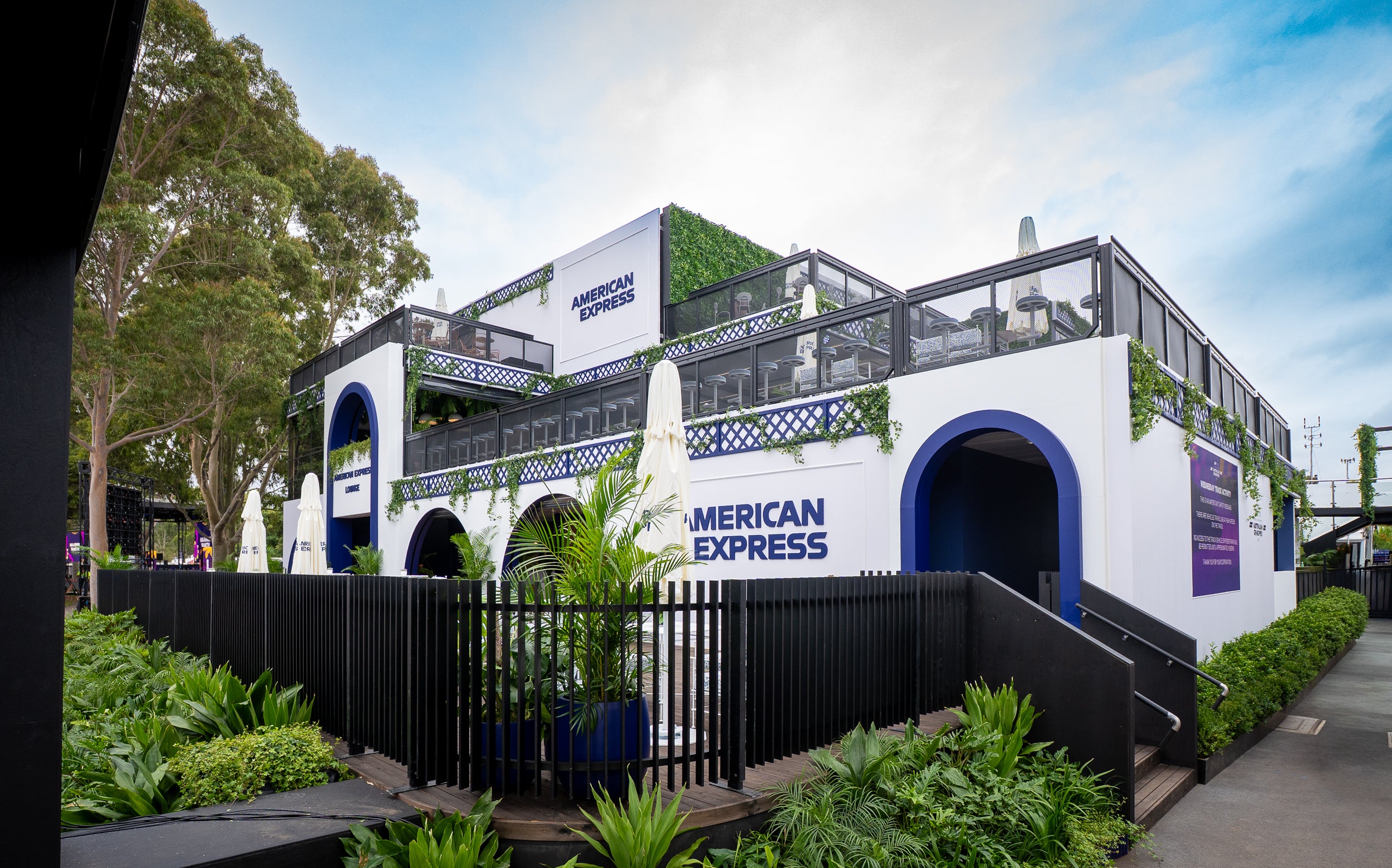 Marquee structure with American Express branding surrounded by greenery at Australian Grand Prix