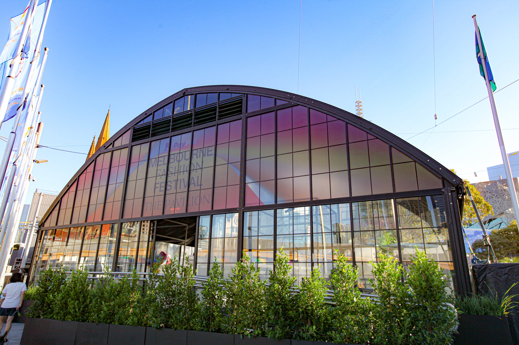 Exterior shot of the Atrium Structure at Melbourne Fashion Festival, with custom branding on the windows.