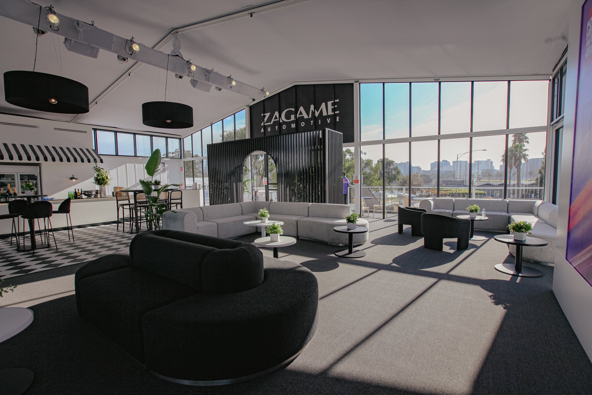 Zagame Marquee at Australian Grand Prix, with black and white furniture inside