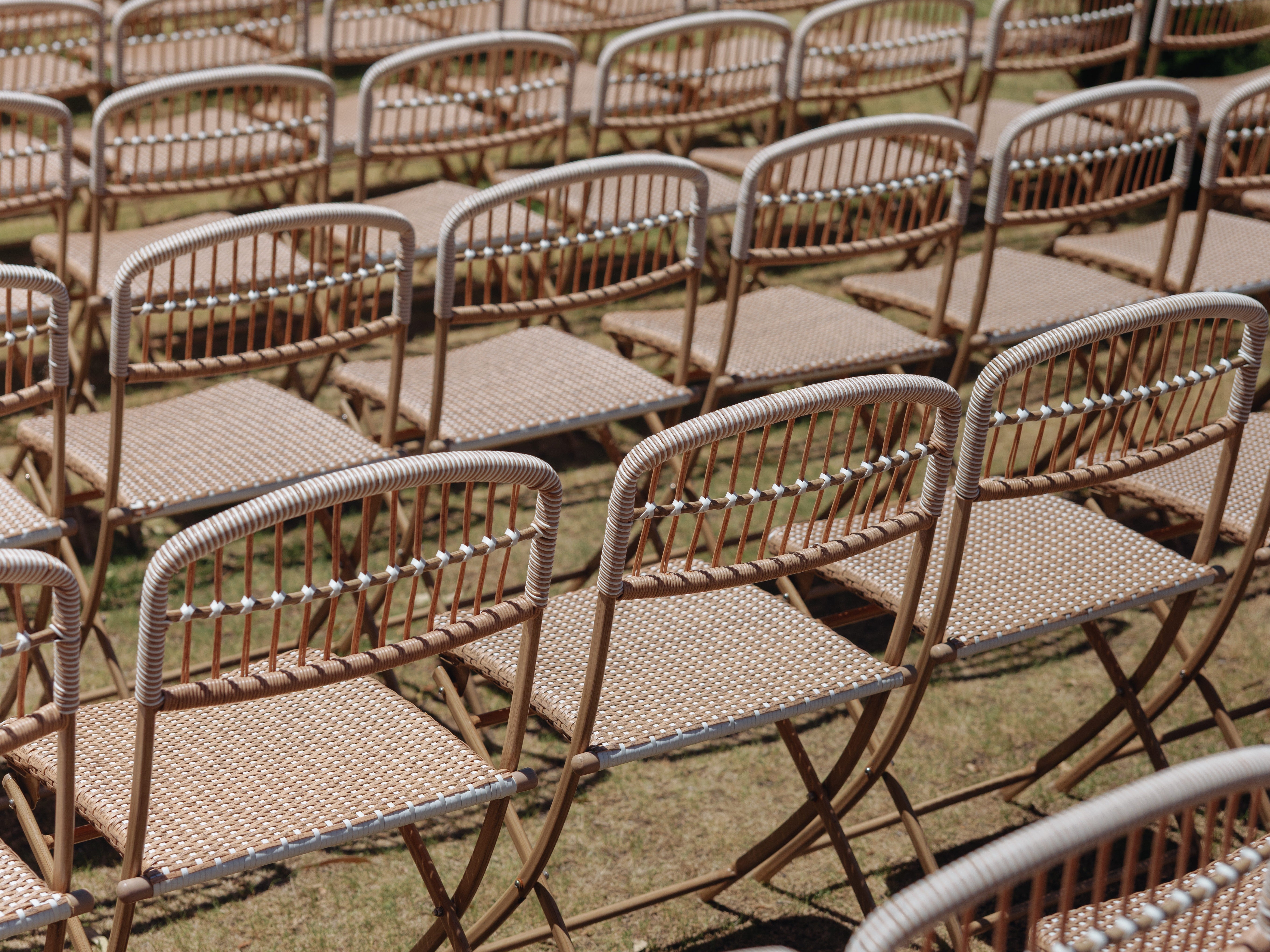 Flip chairs arranged in a row at a wedding