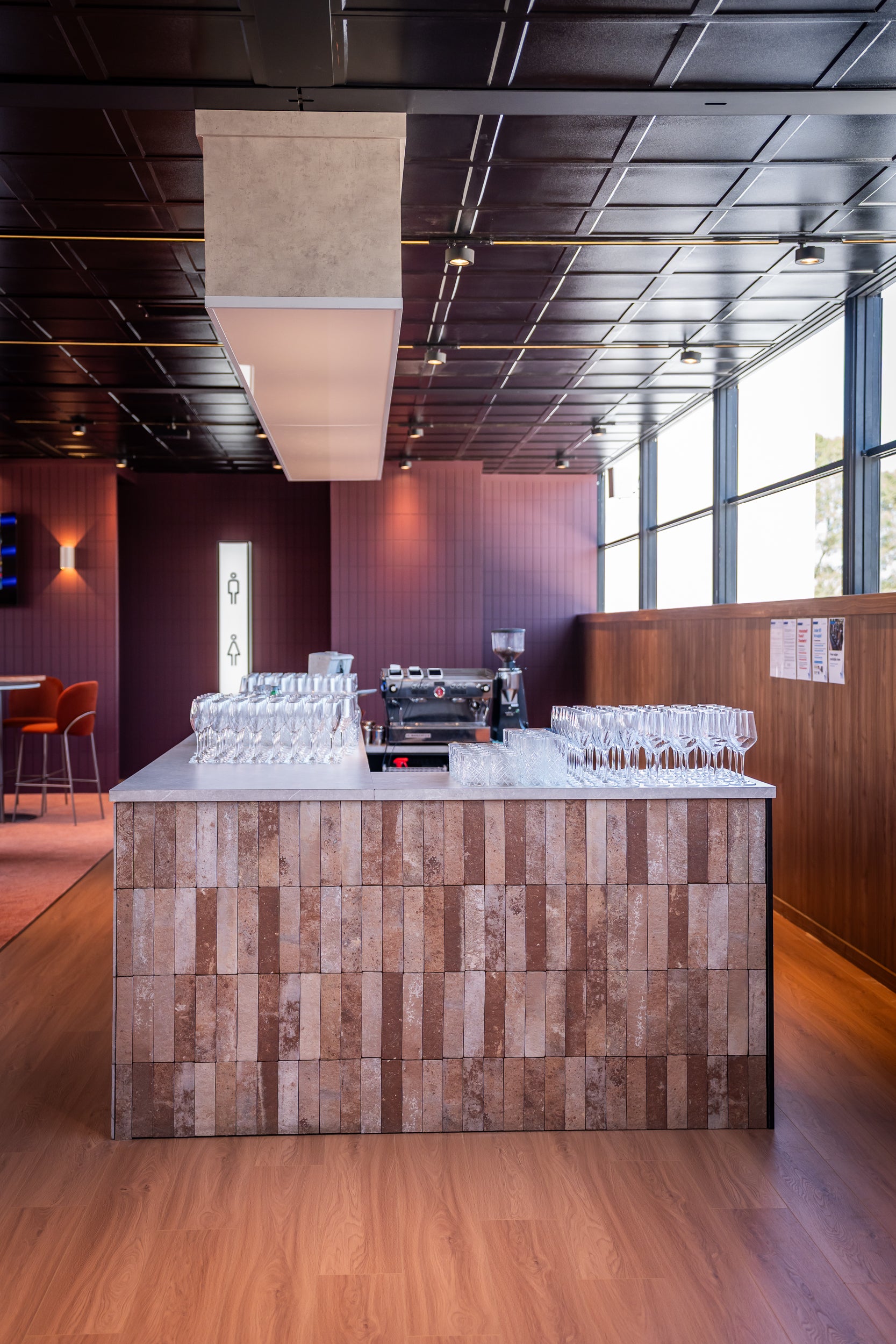 Modern bar counter with glassware in a stylish interior setting
