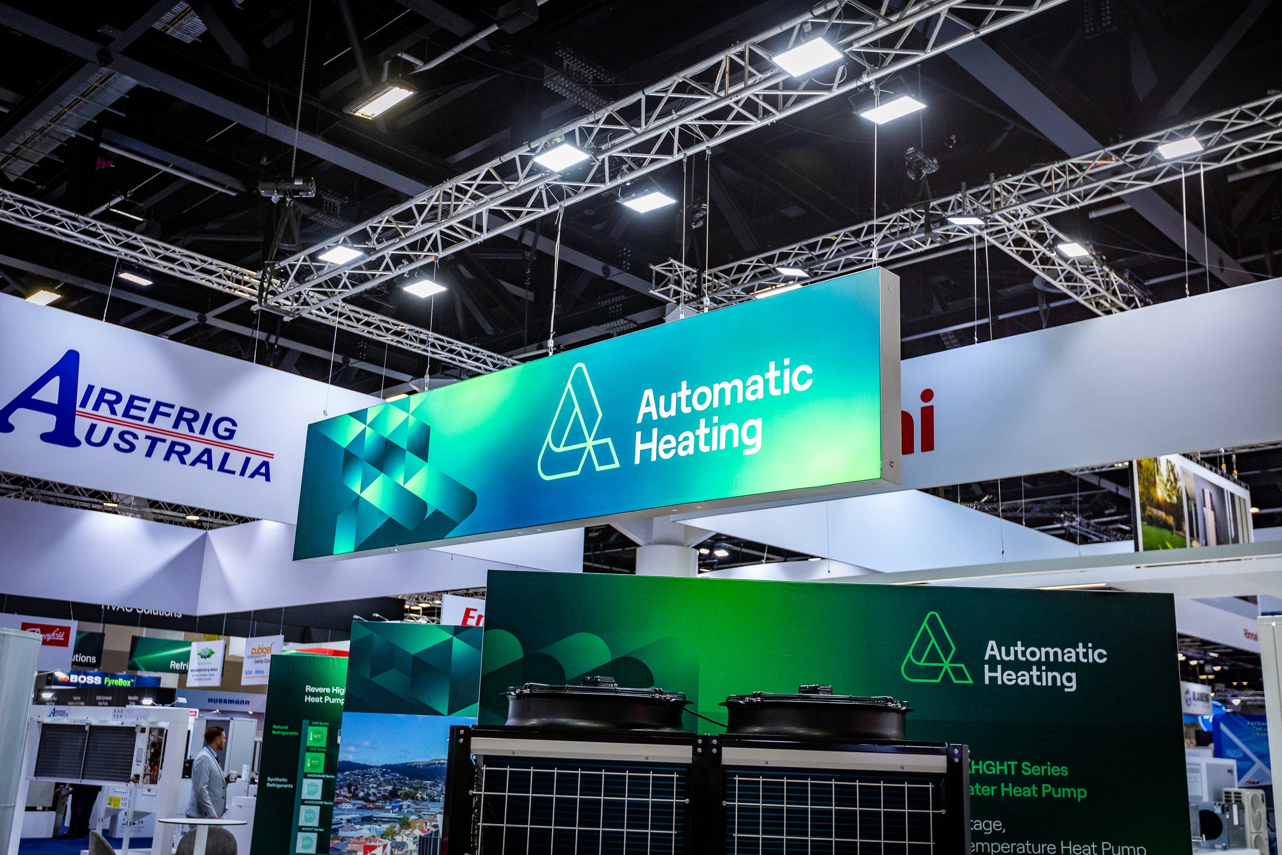 Exhibition booth with 'Airefrig Australia' and 'Automatic Heating' branding as a rigged lightbox.