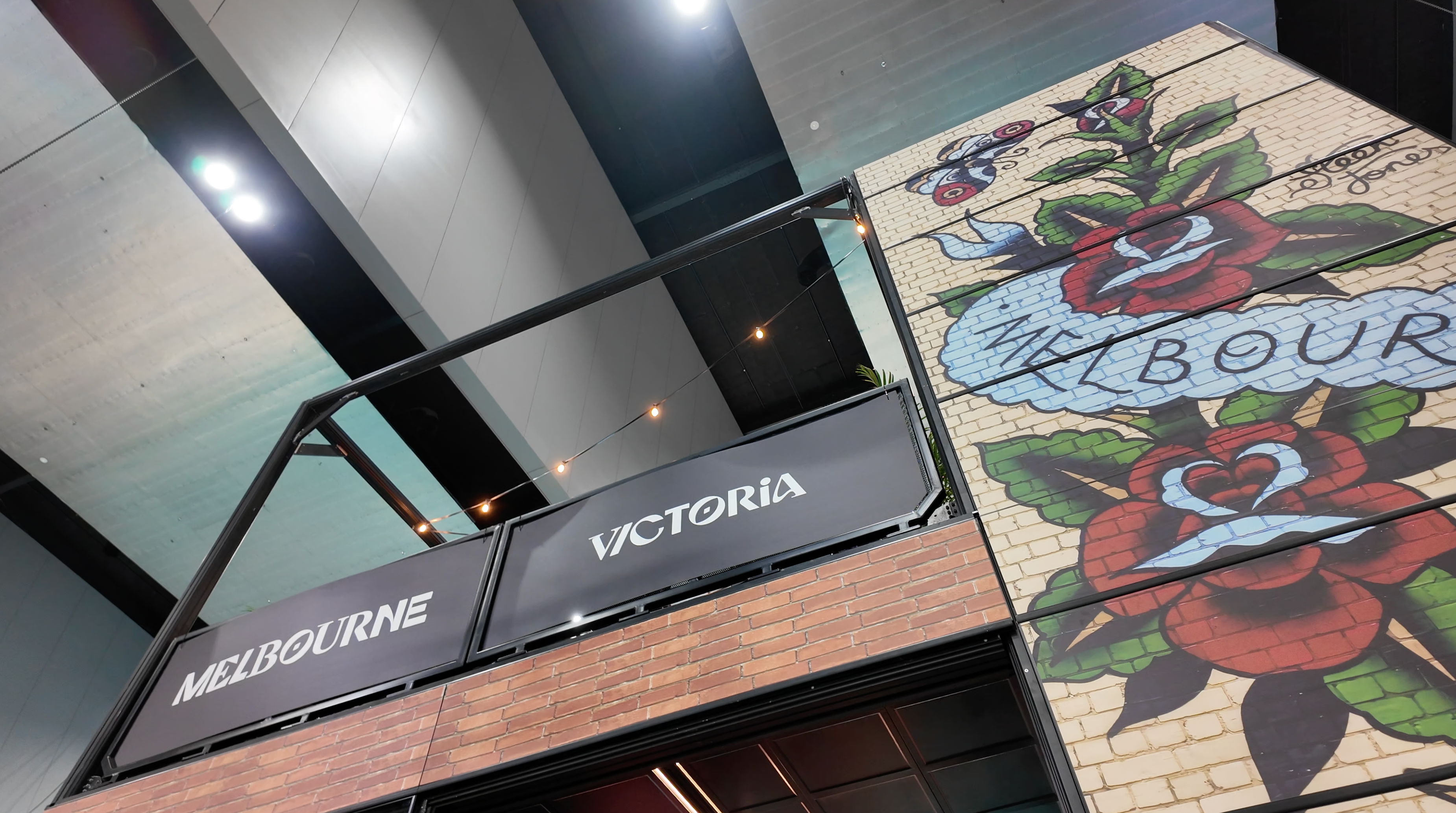 Mosaic artwork with 'Melbourne' and 'Victoria' signs on the external facade of a Highline Structure at AIME 2026. Shot at Melbourne Convention and Exhibition Centre (MCEC)