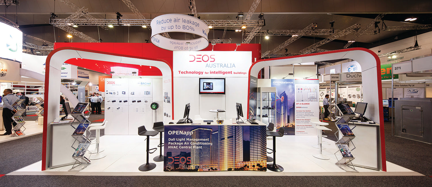Exhibition booth with various displays and branding at a trade show.