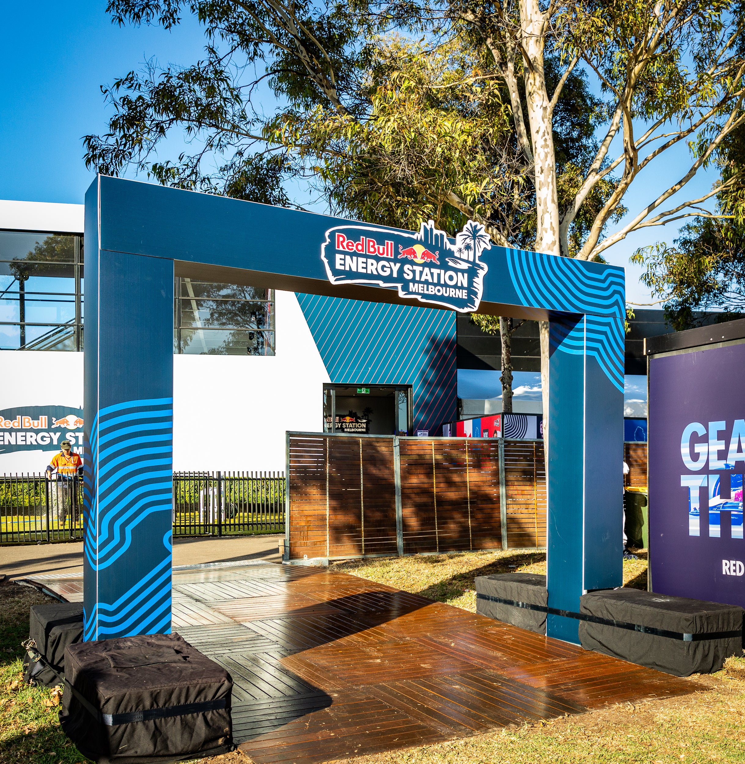 Blue Red Bull Energy Station structure with branding in an outdoor setting- taken at Australian Grand Prix