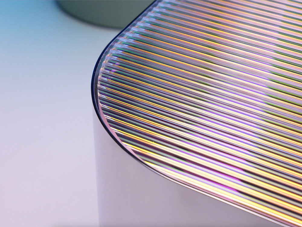 Close-up of a textured surface with multicolored lines on a light background. Pictured: or Zeon Coffee Table