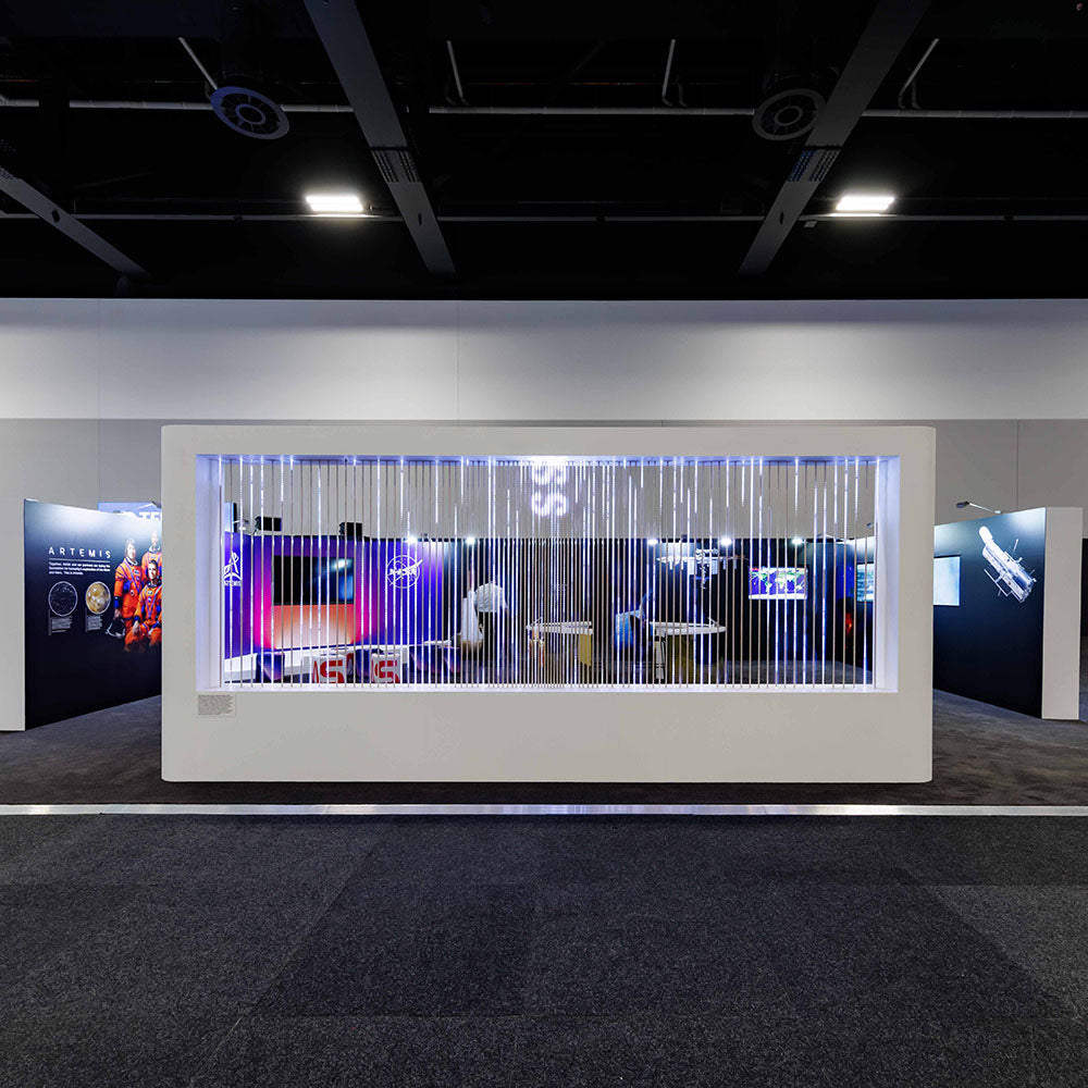 Exhibition display with colorful lighting and custom fittings in a modern indoor setting